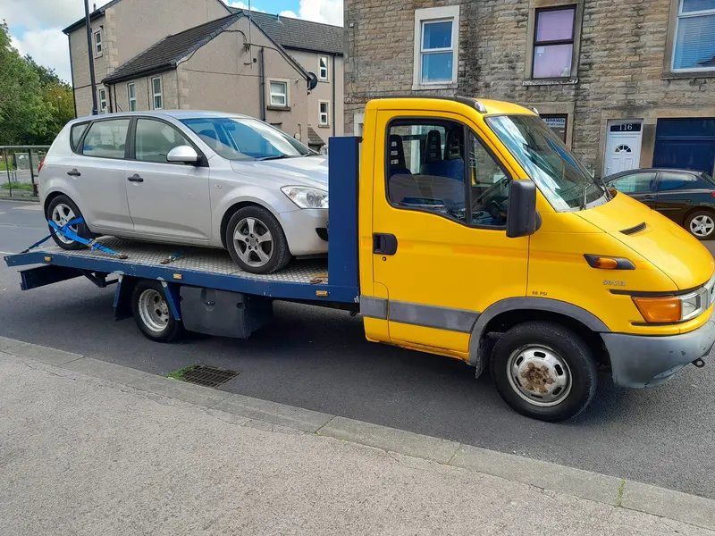 Non-running car collected for scrap in Preston